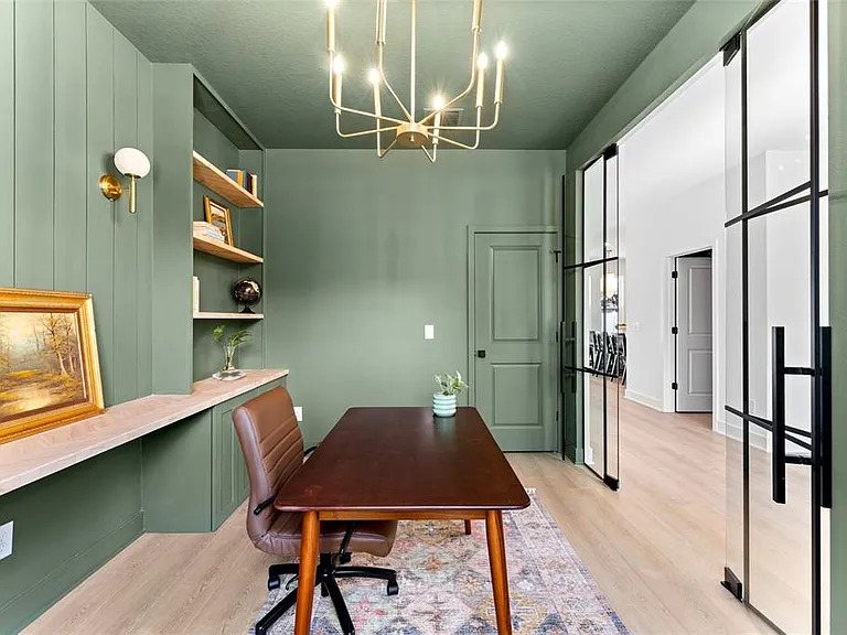 Finished home office with custom built-ins by Wages Construction