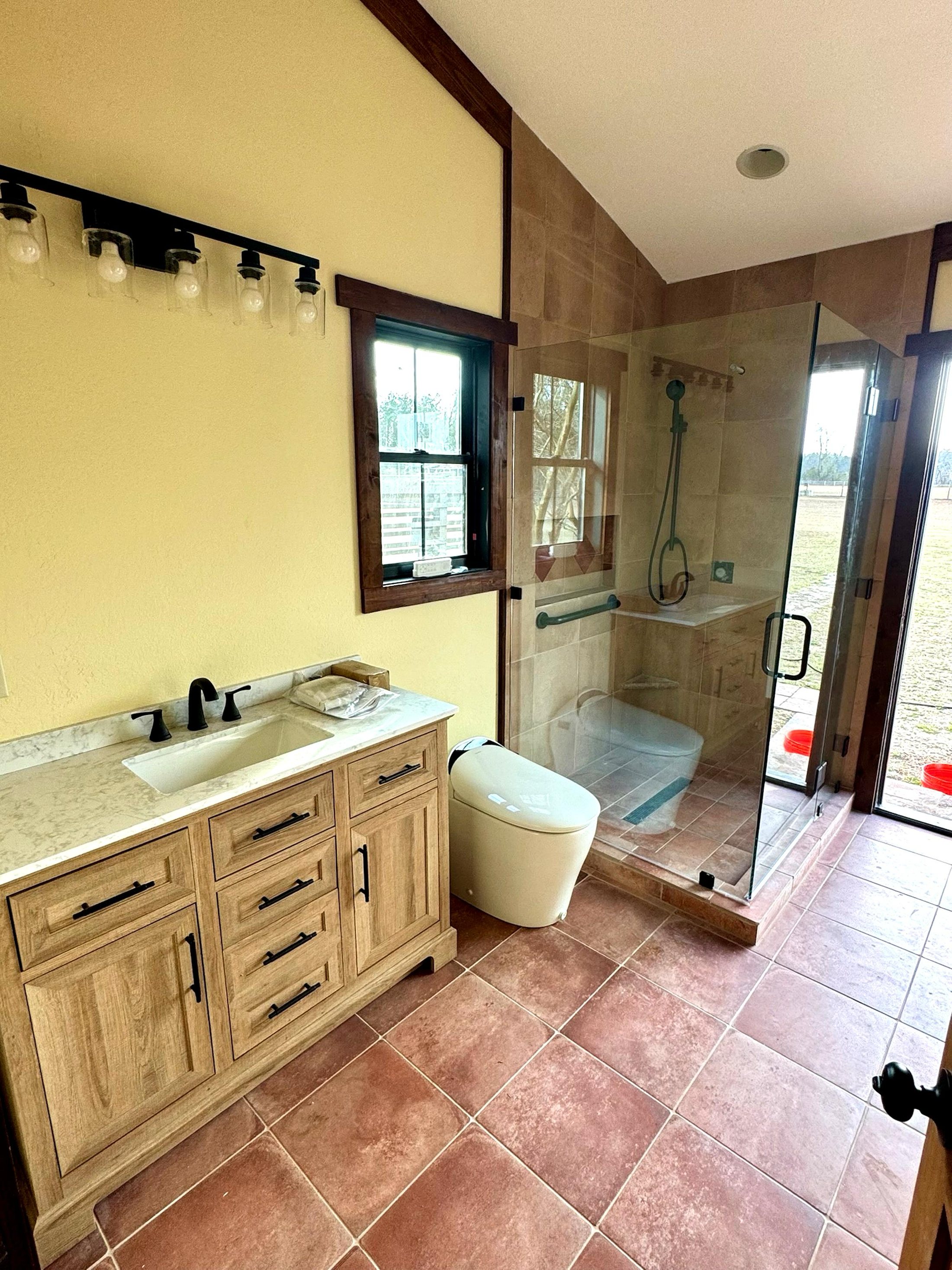 Bathroom remodel with walk-in tile shower by Wages Construction